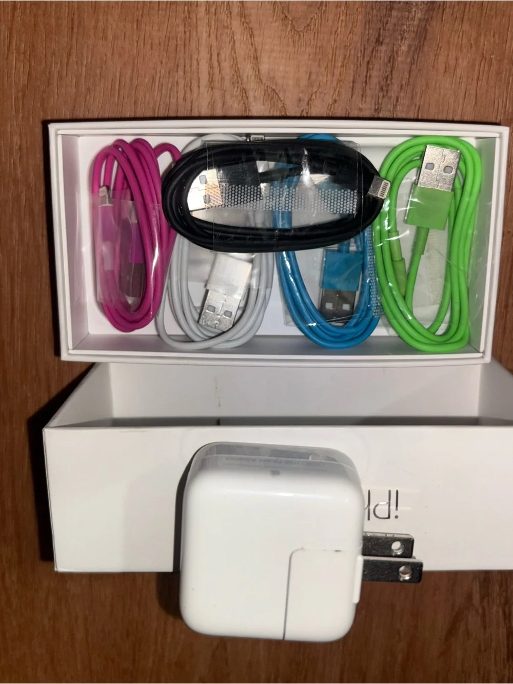 5 collared USB to type A iPhone charging cords and a USB charging block